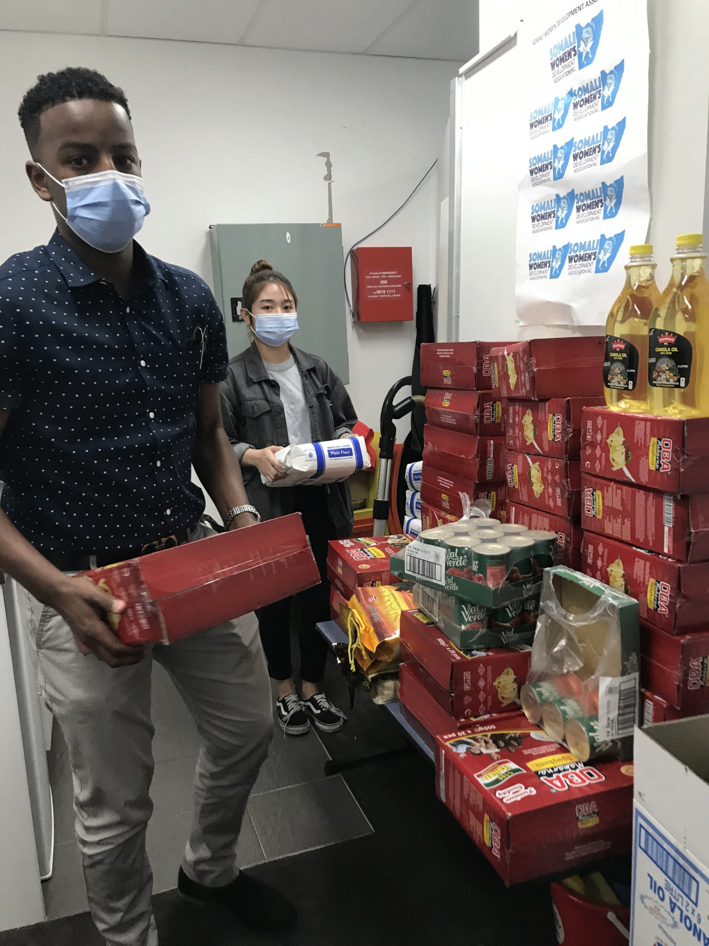 Community member collecting an emergency food relief box from SWDA