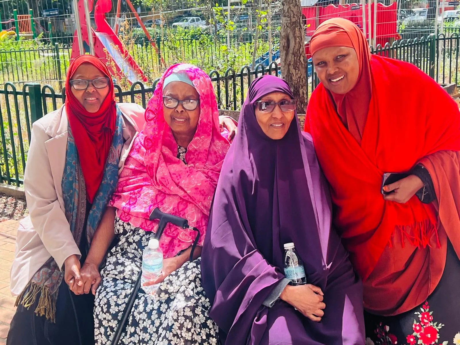 Somali elders sitting together outdoors at an SWDA elders' activity in Kensington