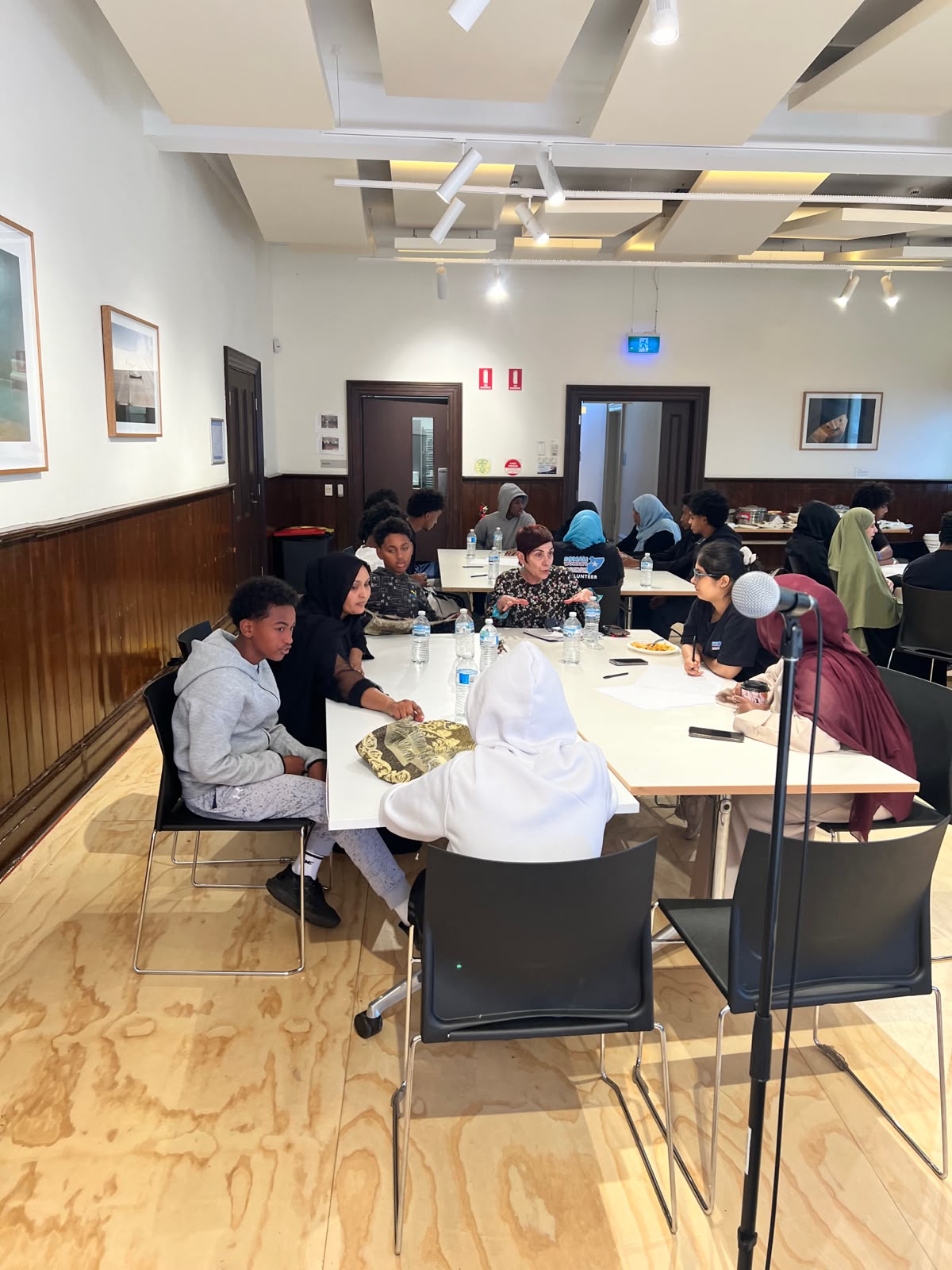 Youth and staff in discussion at an SWDA community engagement session
