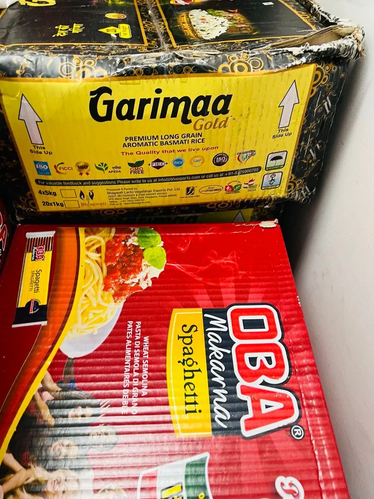 Boxes of basmati rice and pasta ready for SWDA emergency food relief hampers