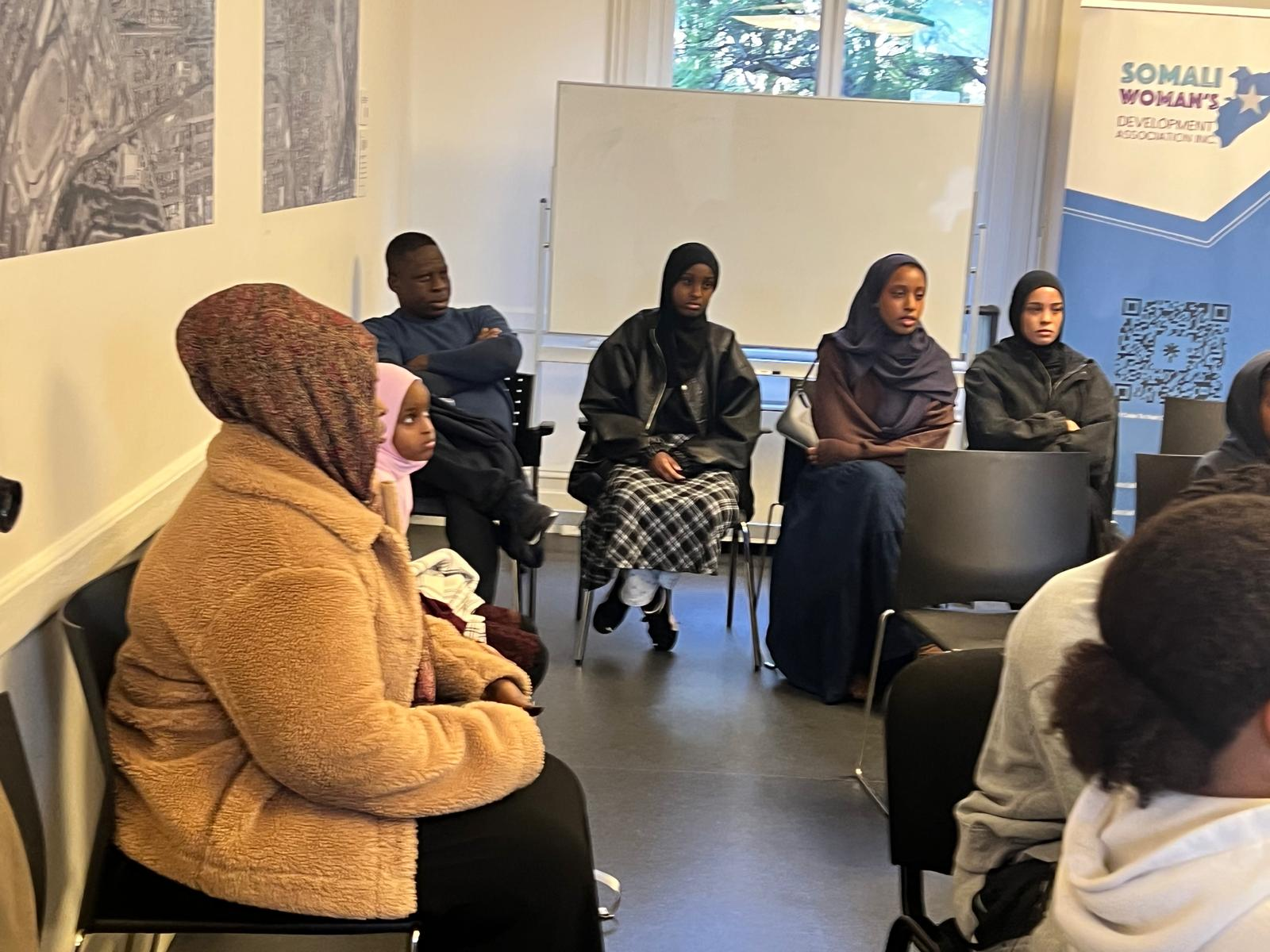 SWDA workshop attendees seated in discussion during a community employment session
