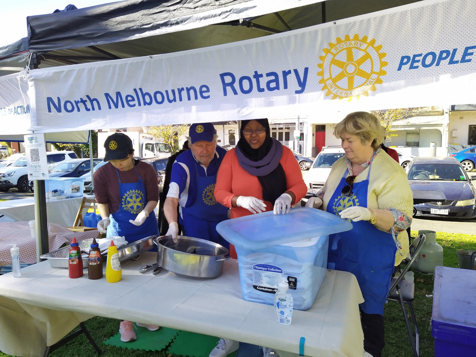 SWDA and North Melbourne Rotary running a community food relief stall