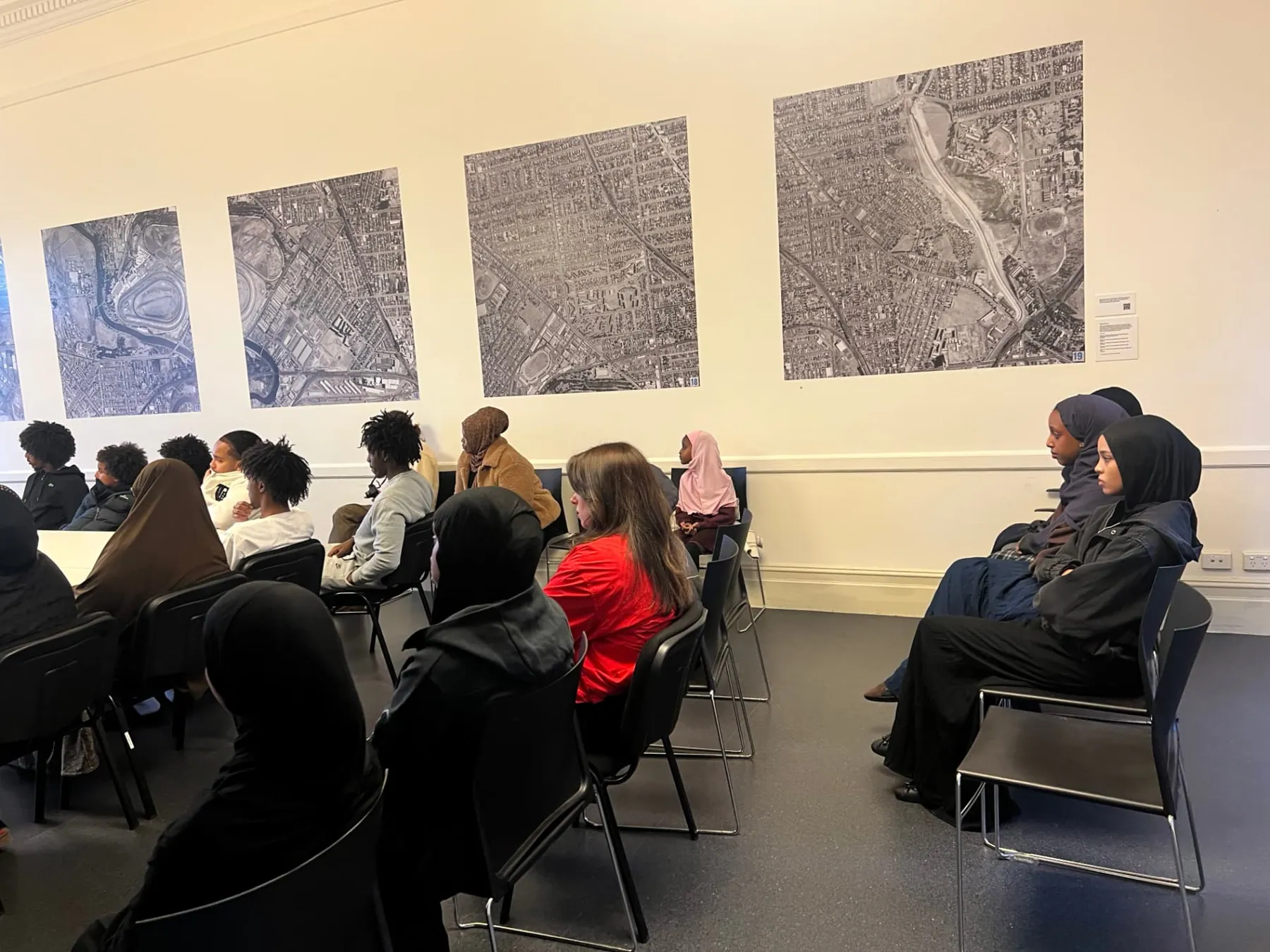 Community members and young people seated at an SWDA employment information session