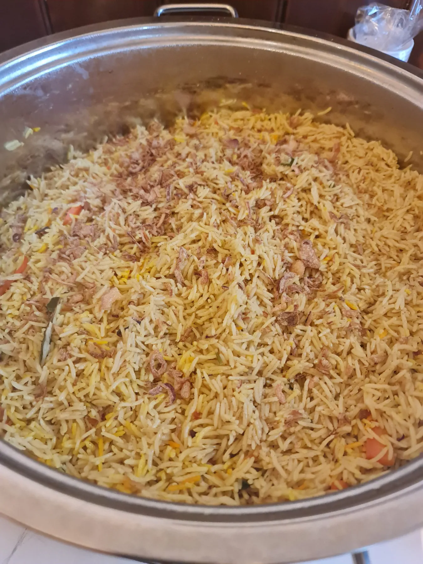 Large pot of cooked rice prepared for families receiving SWDA food relief