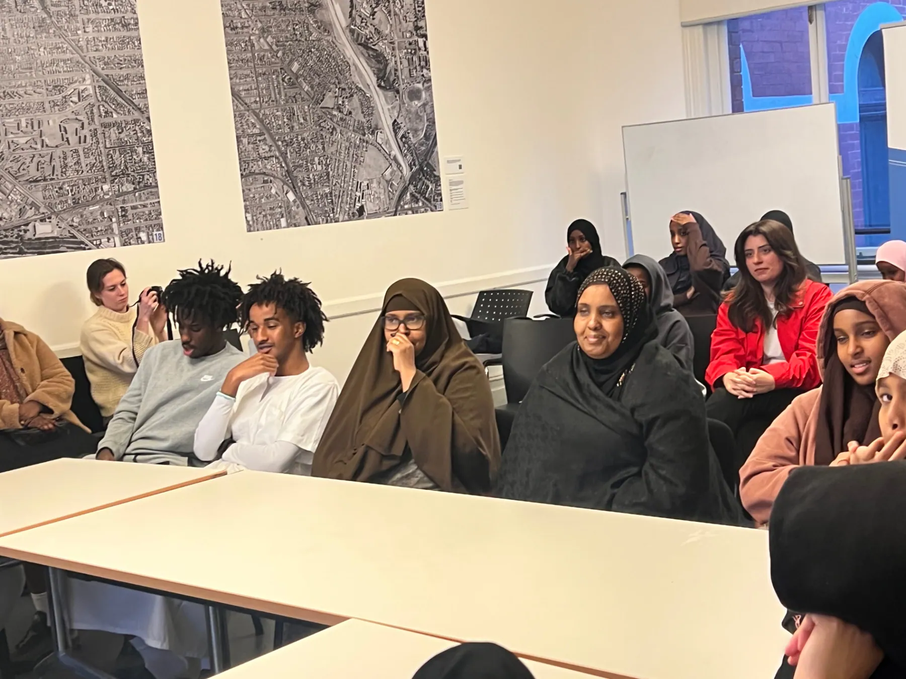 Community members and young people seated together during an SWDA employment workshop