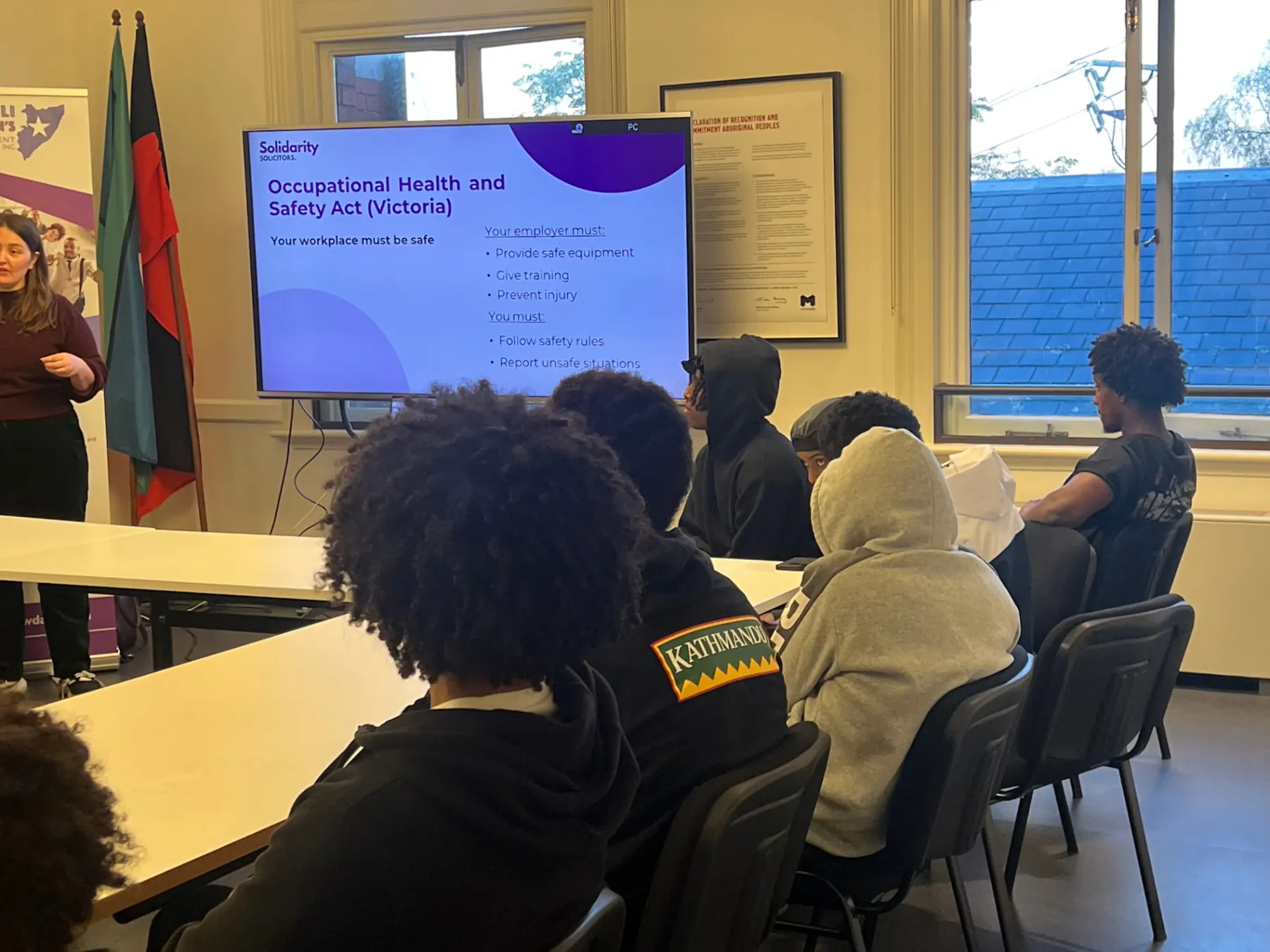 Young jobseekers listening to a workplace safety presentation at an SWDA workshop