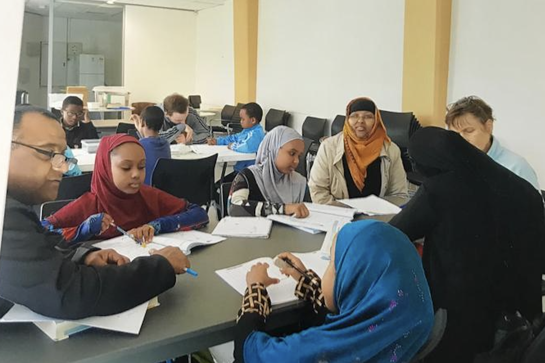 SWDA Homework Club students and tutors in session