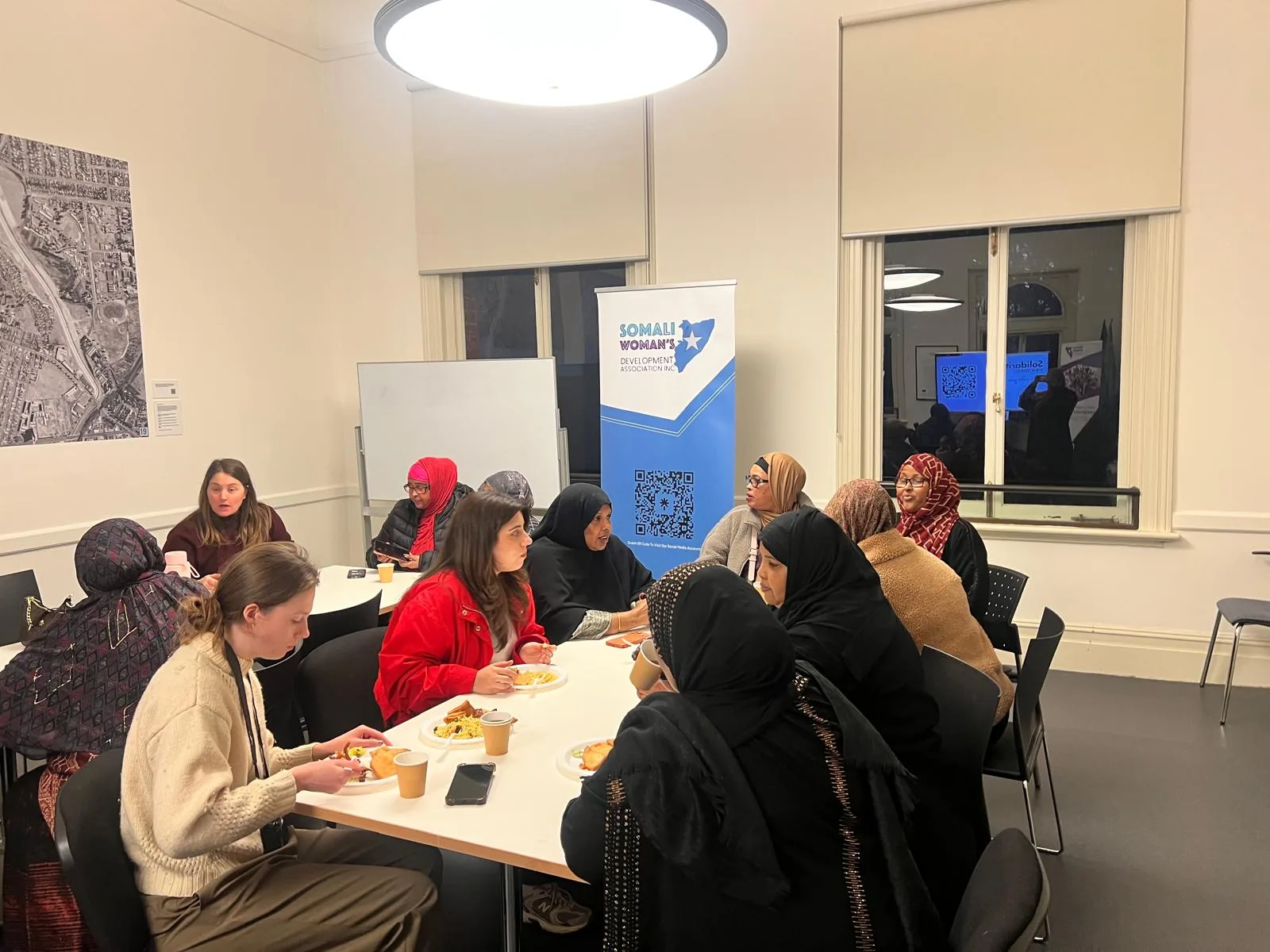 Women and partners sharing refreshments at an Employment Brokers gathering