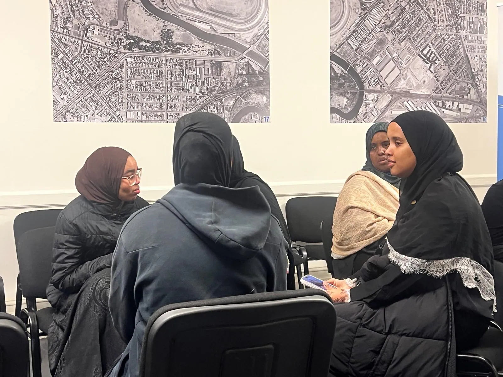 Women discussing employment pathways in a small workshop group