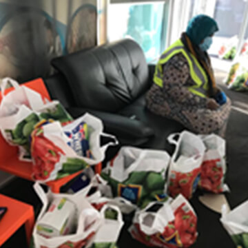 Bags of fresh groceries sorted for community food relief delivery