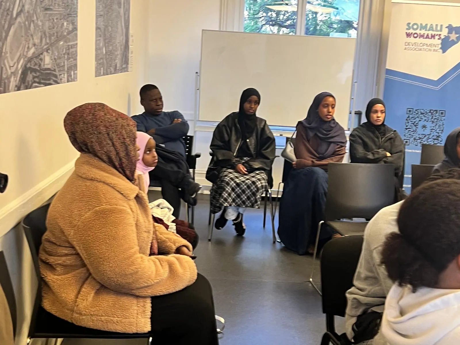 SWDA workshop attendees seated in discussion during a community employment session