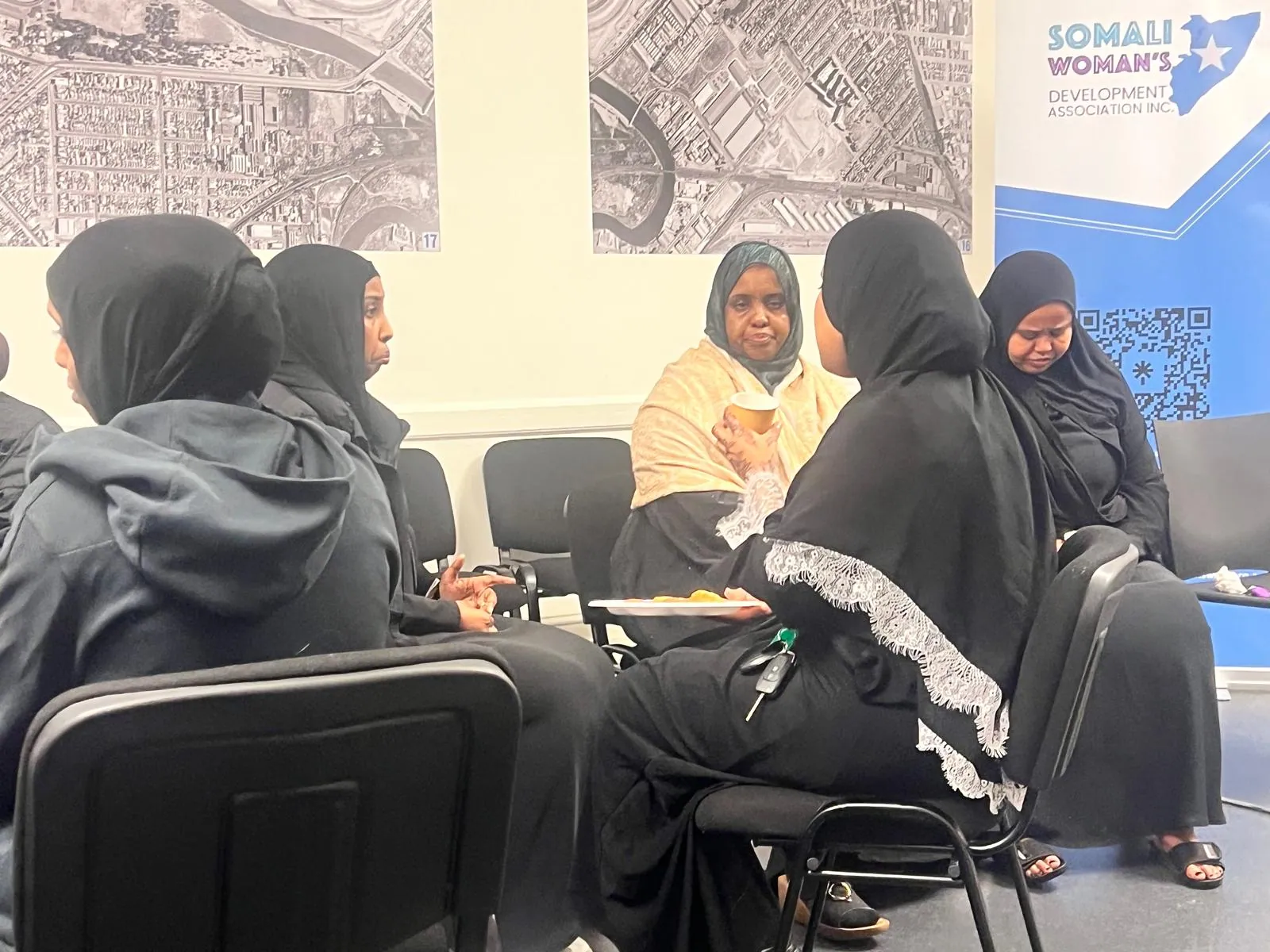 Community members sharing refreshments and conversation during the workshop