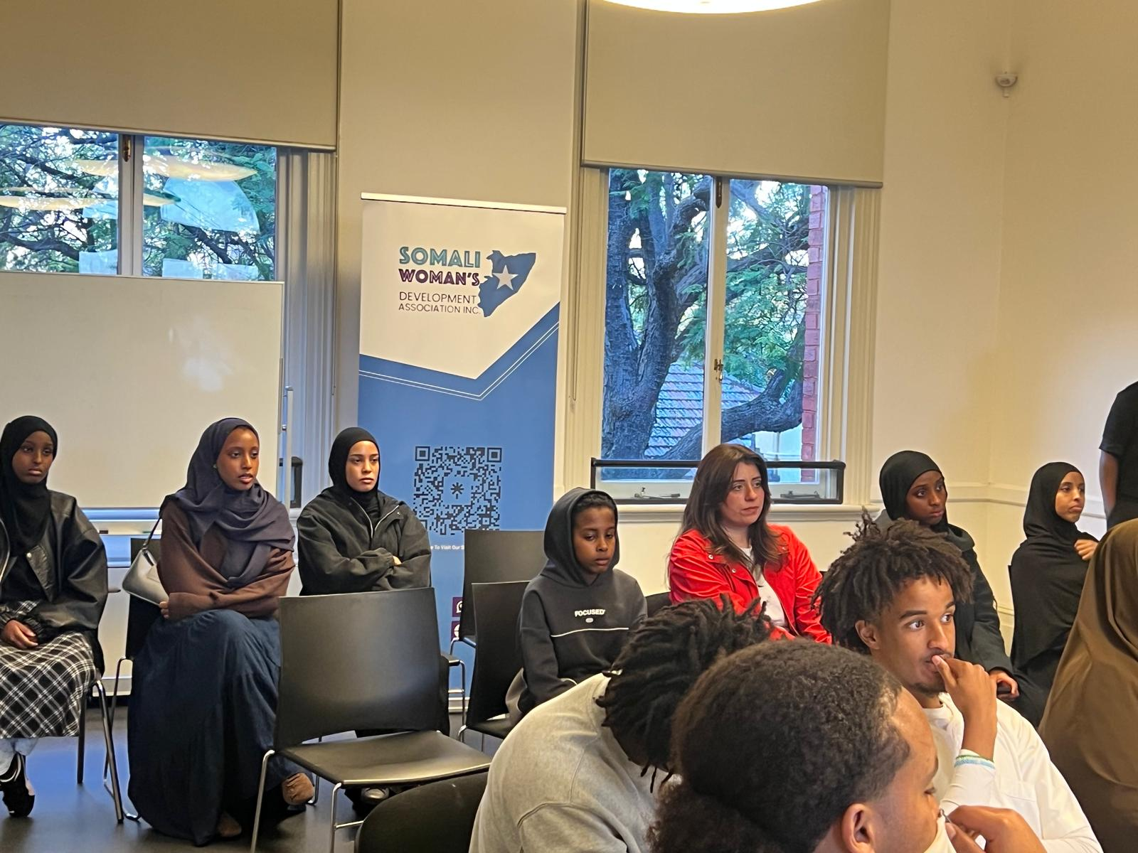 Young people and community participants listening during an SWDA workshop