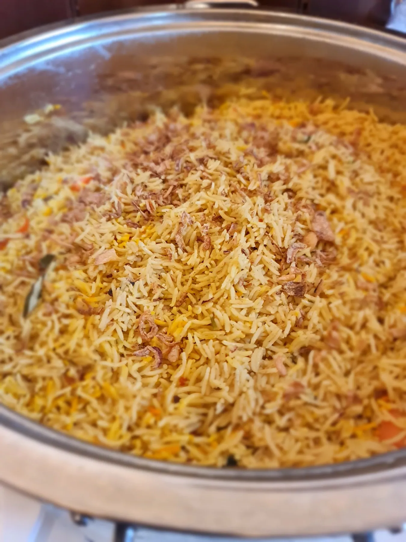 Freshly cooked spiced rice prepared for SWDA community meals