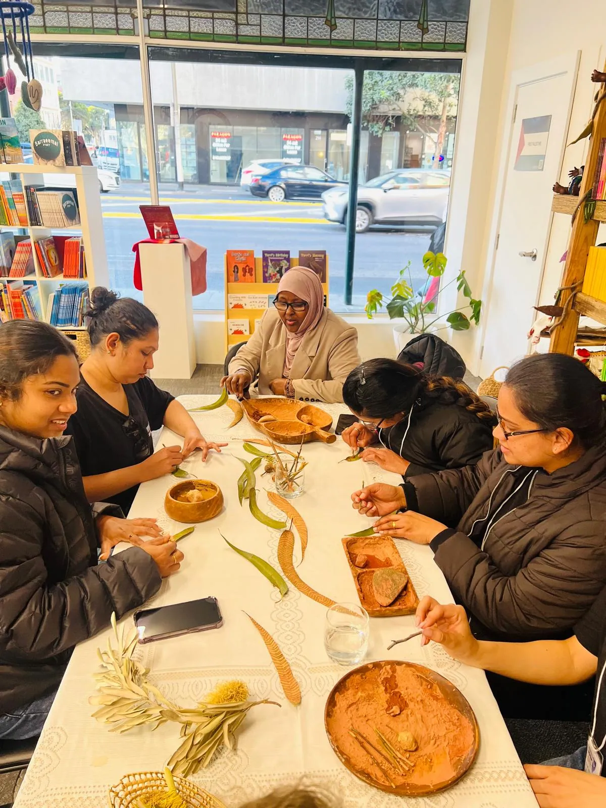 Women taking part in a cultural craft and conversation session at SWDA