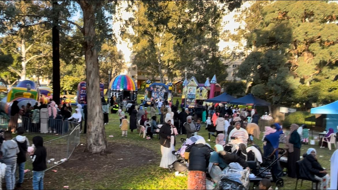 Community members celebrating together at the Multicultural Eid Festival