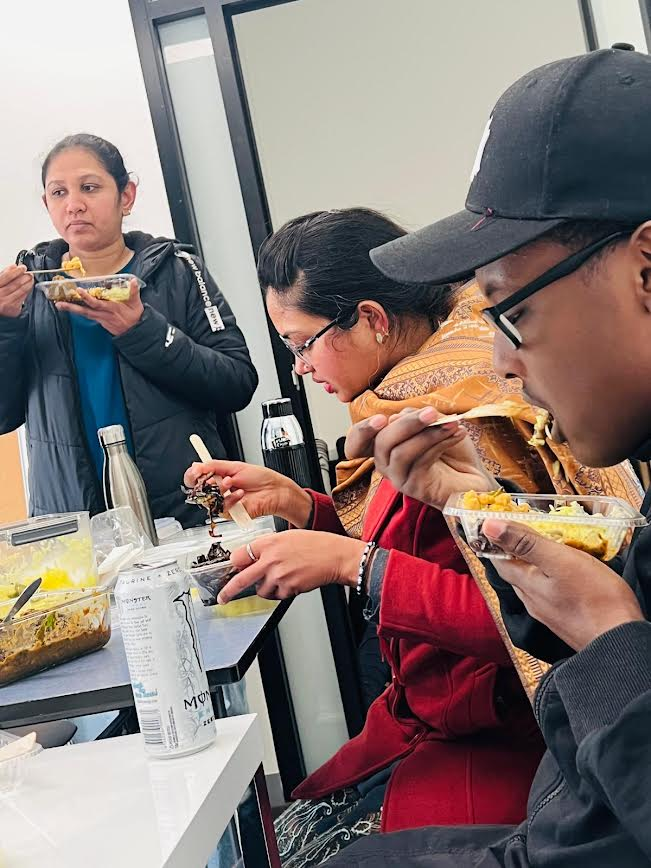 Placement students and community members together at an SWDA workshop lunch