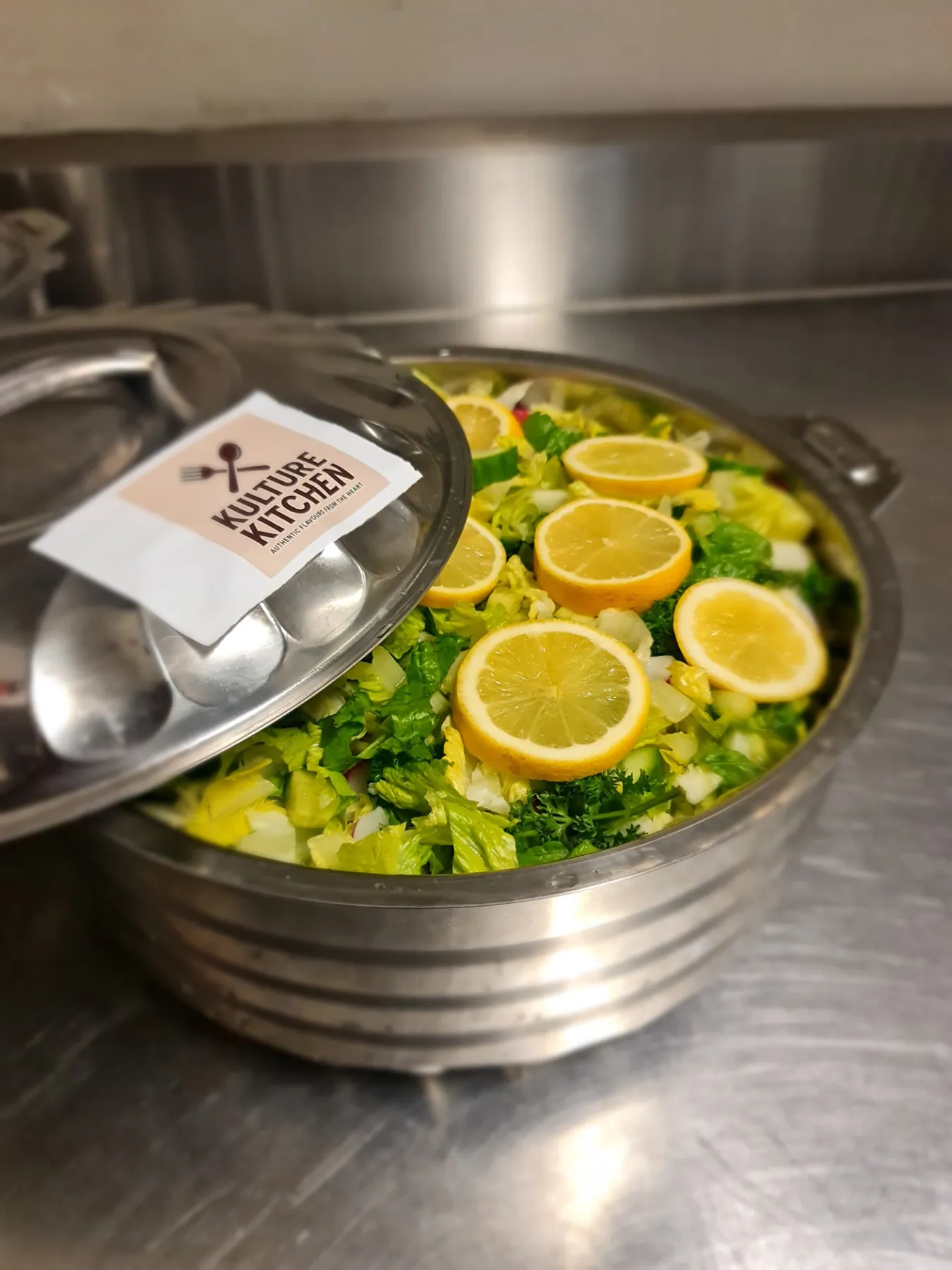 Fresh garden salad prepared in a large serving dish for an SWDA community meal