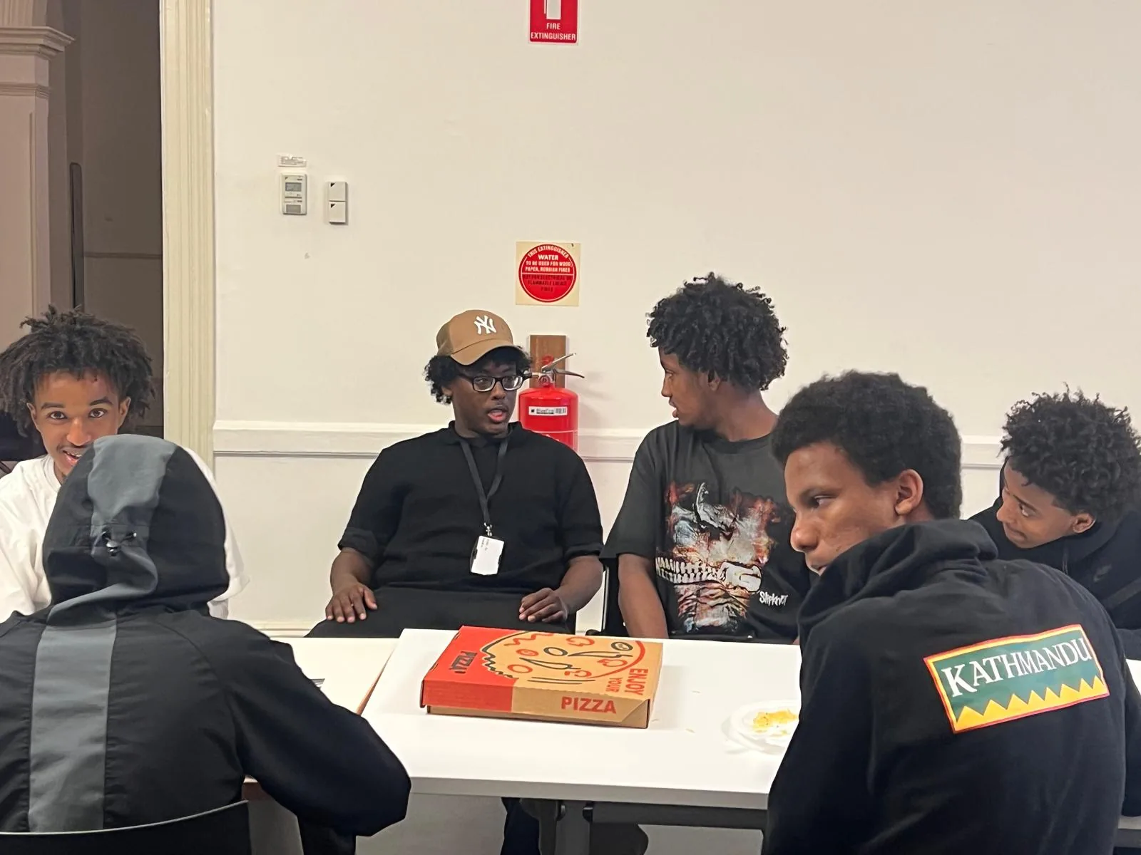 Young participants in conversation during an Employment Brokers workshop activity
