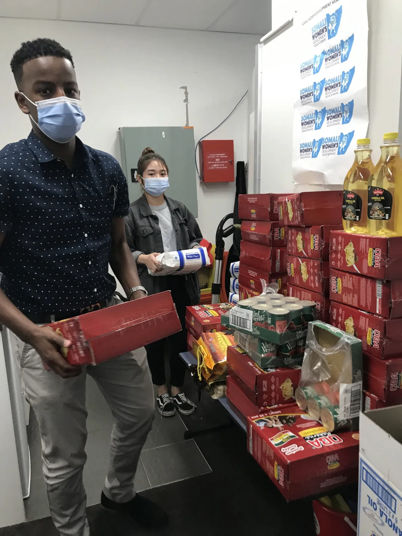 Community member collecting an emergency food relief box from SWDA