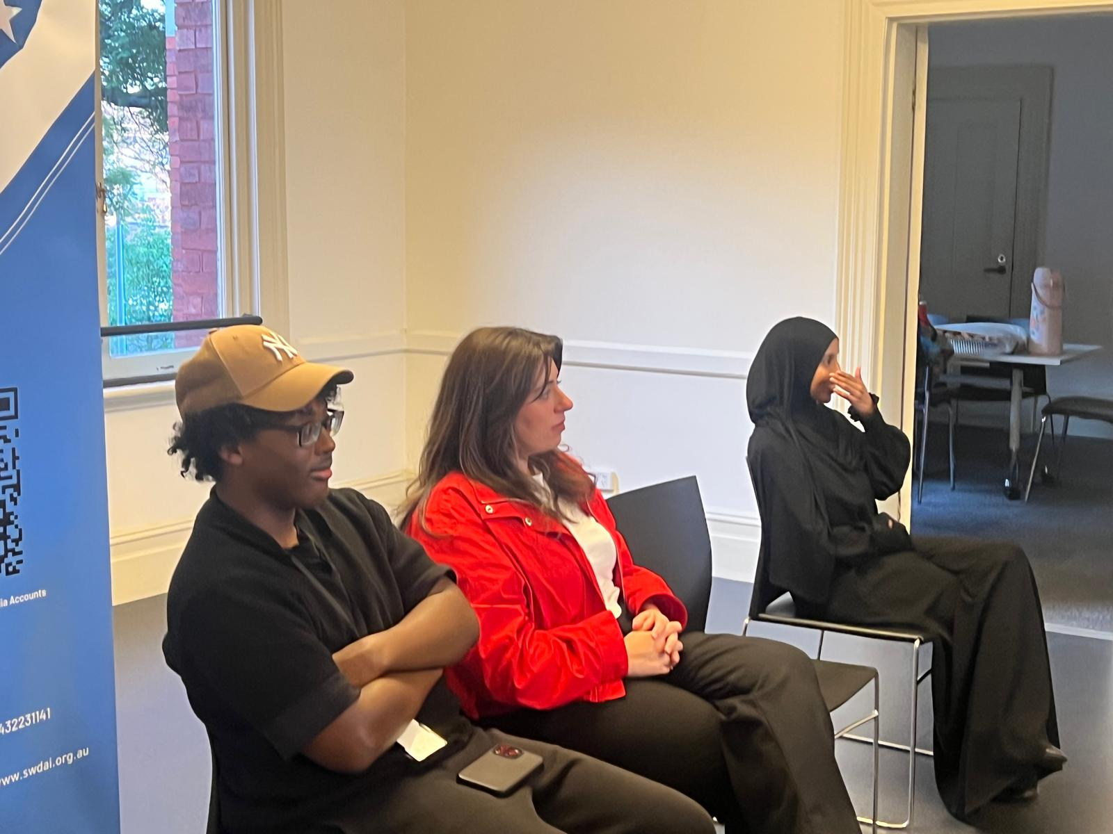 Workshop participants seated together during an SWDA employment session
