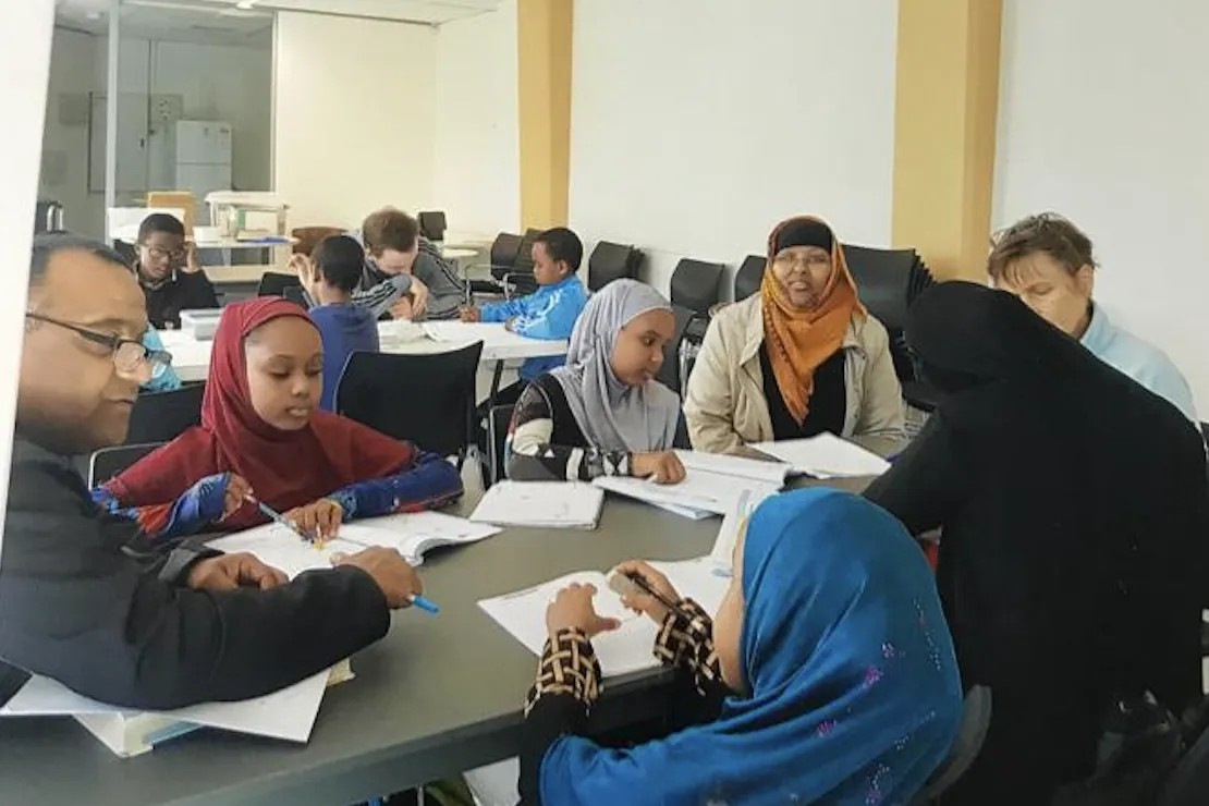 SWDA Homework Club students and tutors in session
