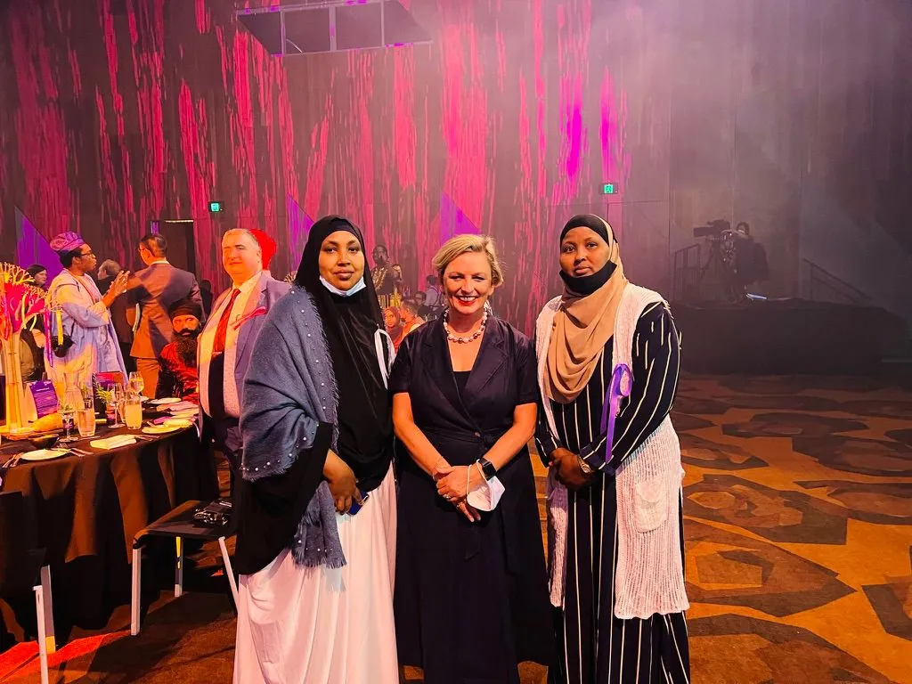 SWDA representatives with a guest at a multicultural community awards night